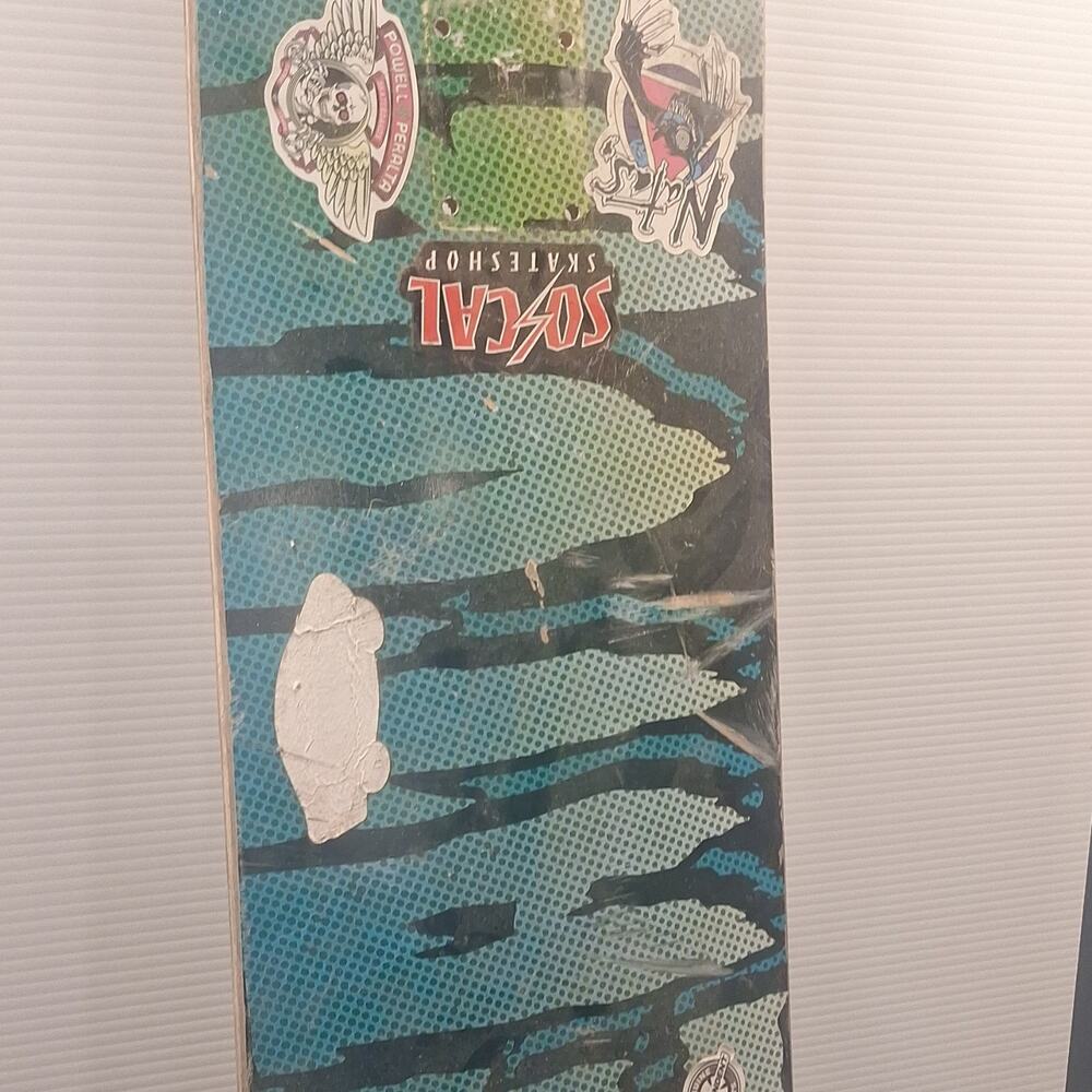 creature Green Pattern Skateboard Deck Featuring Stickers